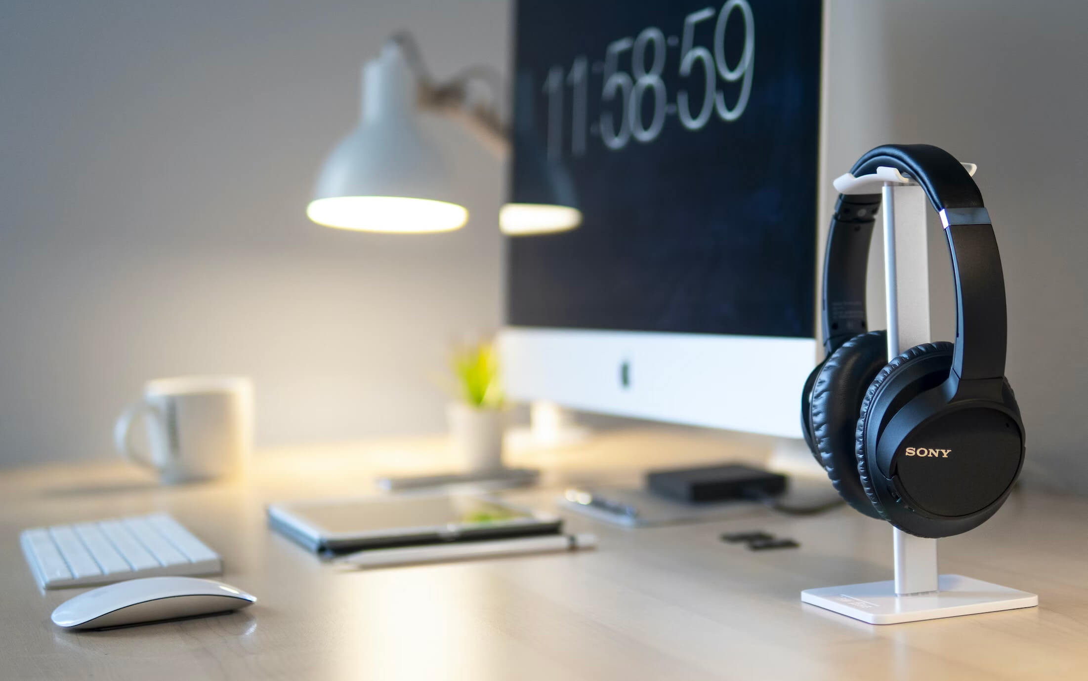 A tidy minimalist workspace with a single laptop and notebook