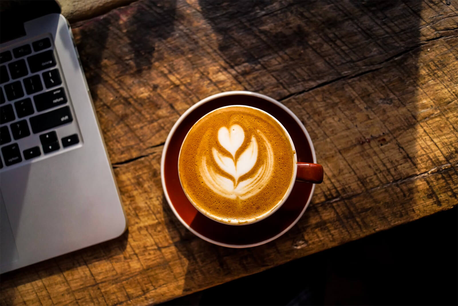 A freshly brewed cup of coffee on a wooden table