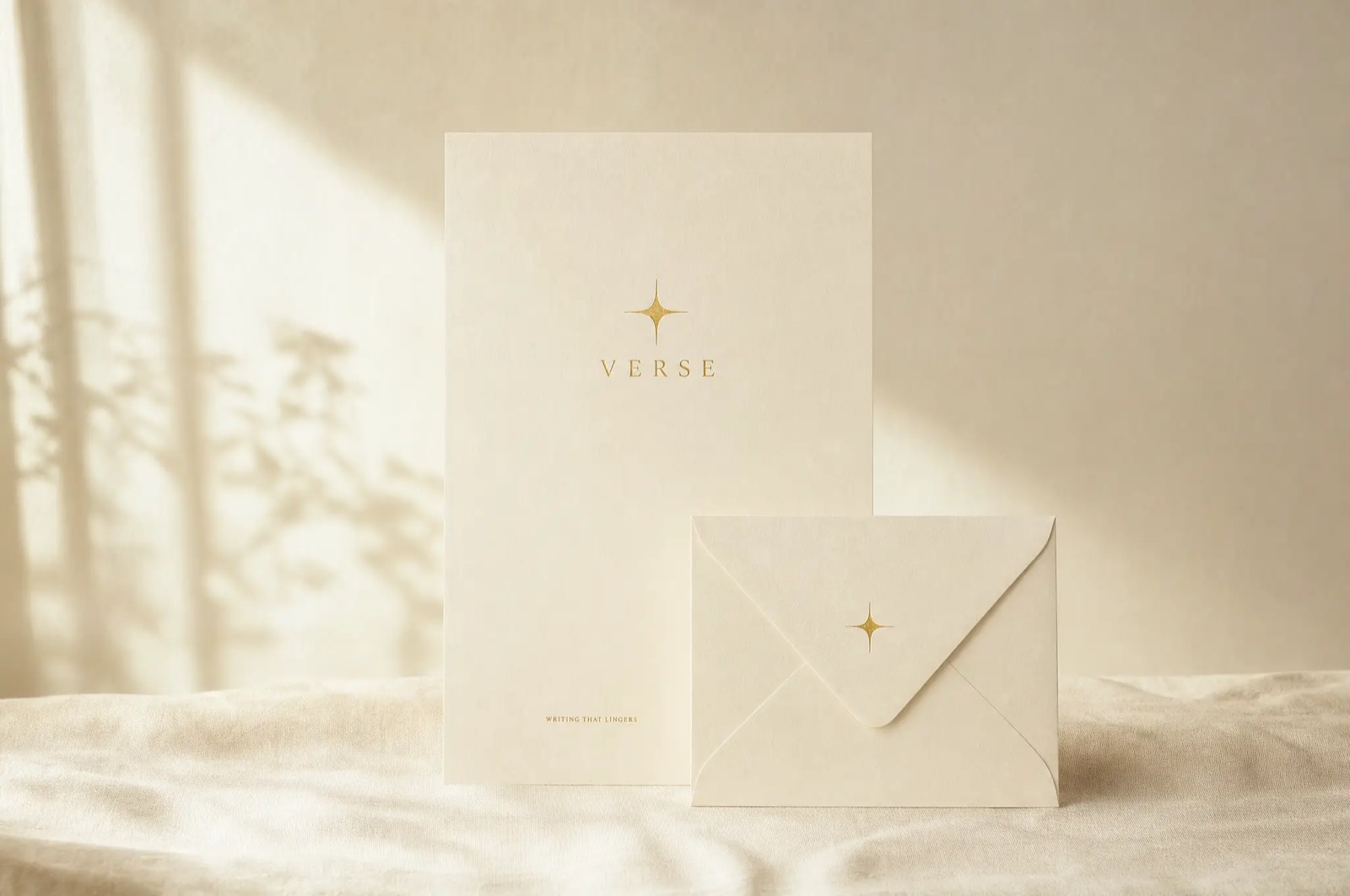 Verse brand identity — the gold star mark foil-stamped on cream paper