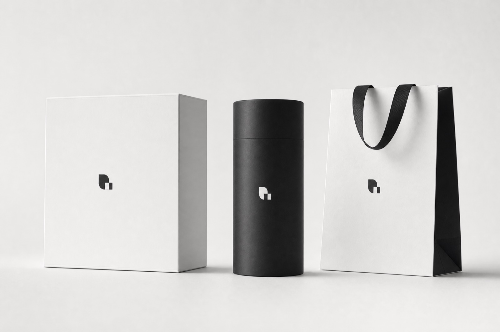 Northwind packaging — a rigid box, a tube and a paper bag carrying a small mark