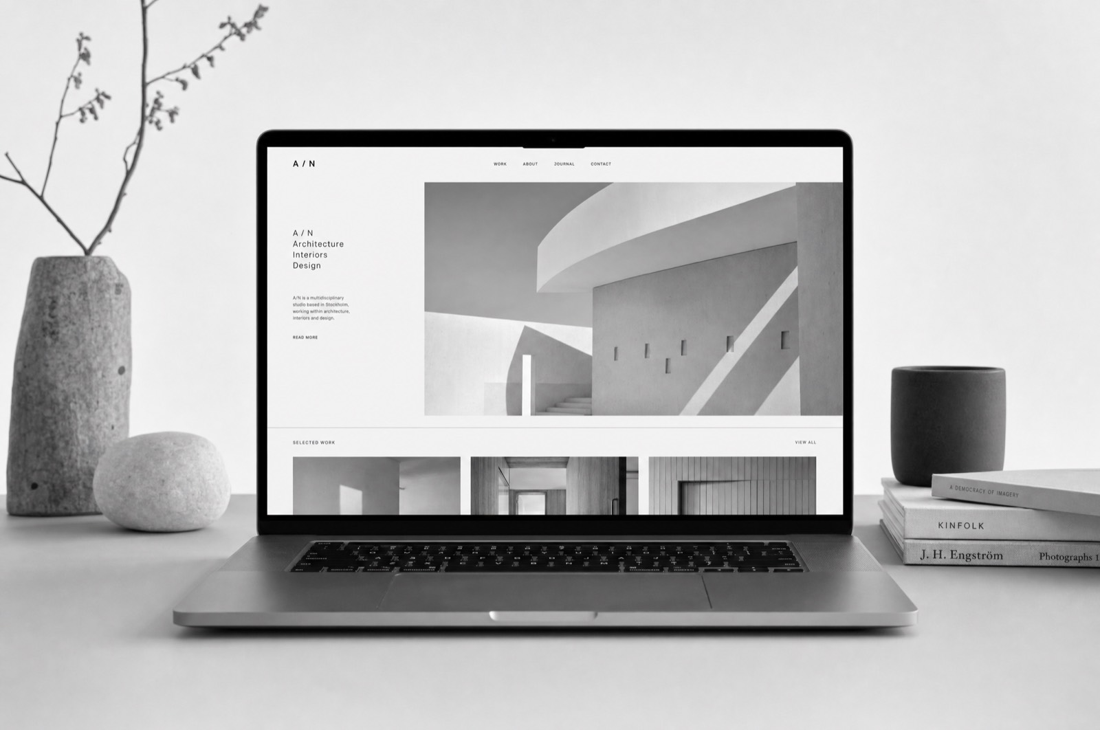 The Tideline studio website open on a laptop, a large photograph beside a short introduction
