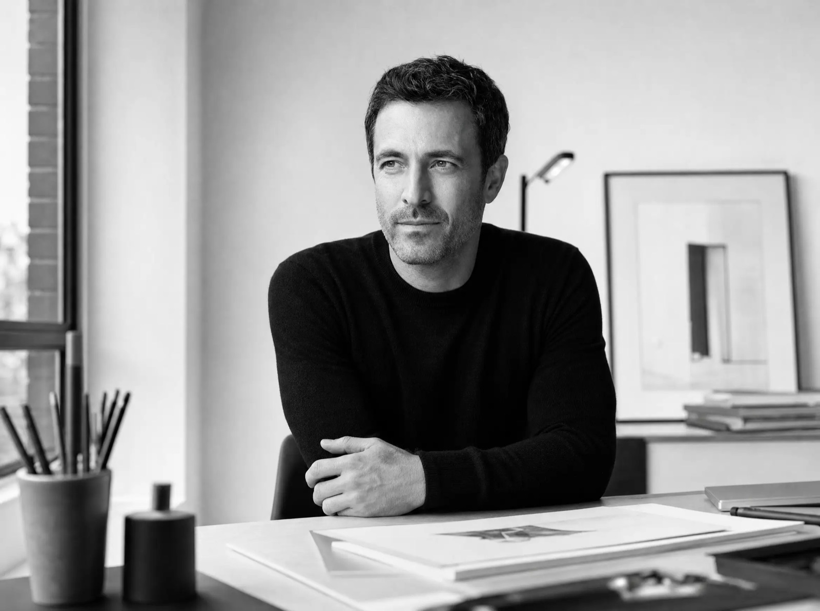 Jordan Vale working at a minimal desk in a bright studio